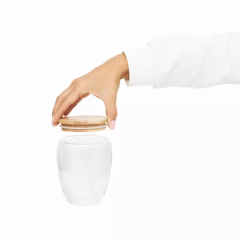 Dwuścienna szklanka z pokrywą z bambusa. Przezroczysta, odporna na temperaturę, o pojemności ok. 250 ml - transparentny (56-0304451)