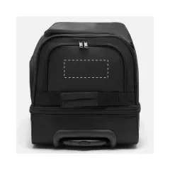 centered on the top flap next to the handle
