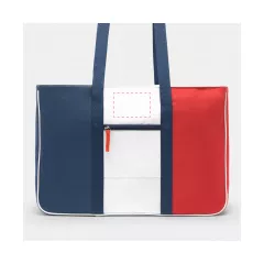 centered on the front above the zipper