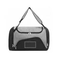 below the zipper on black front compartment